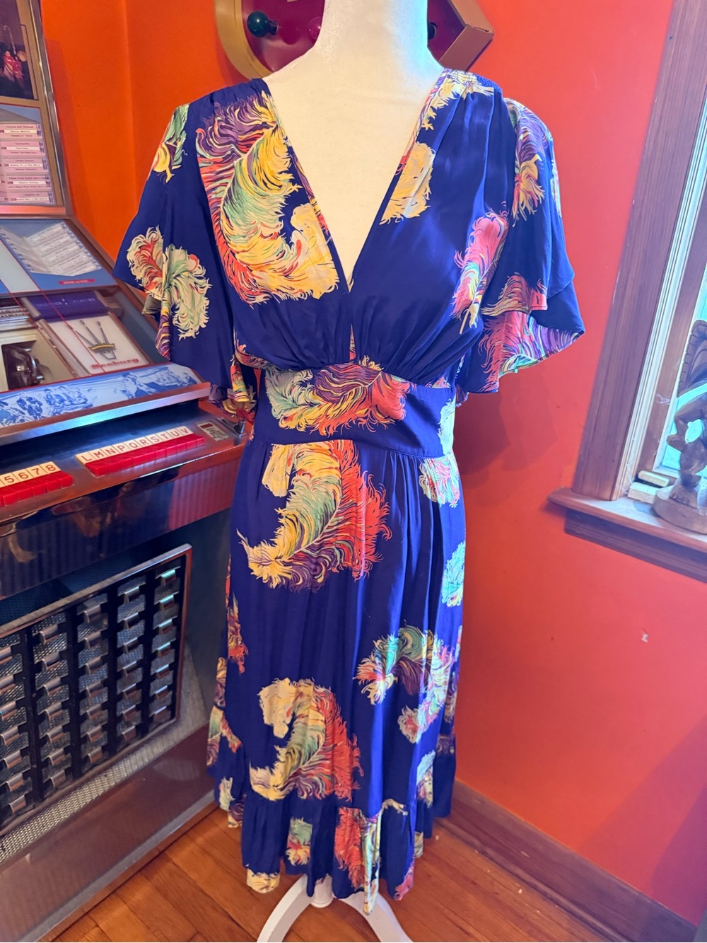 Trashy Diva Violet dress is showgirl feathers print. Size 18